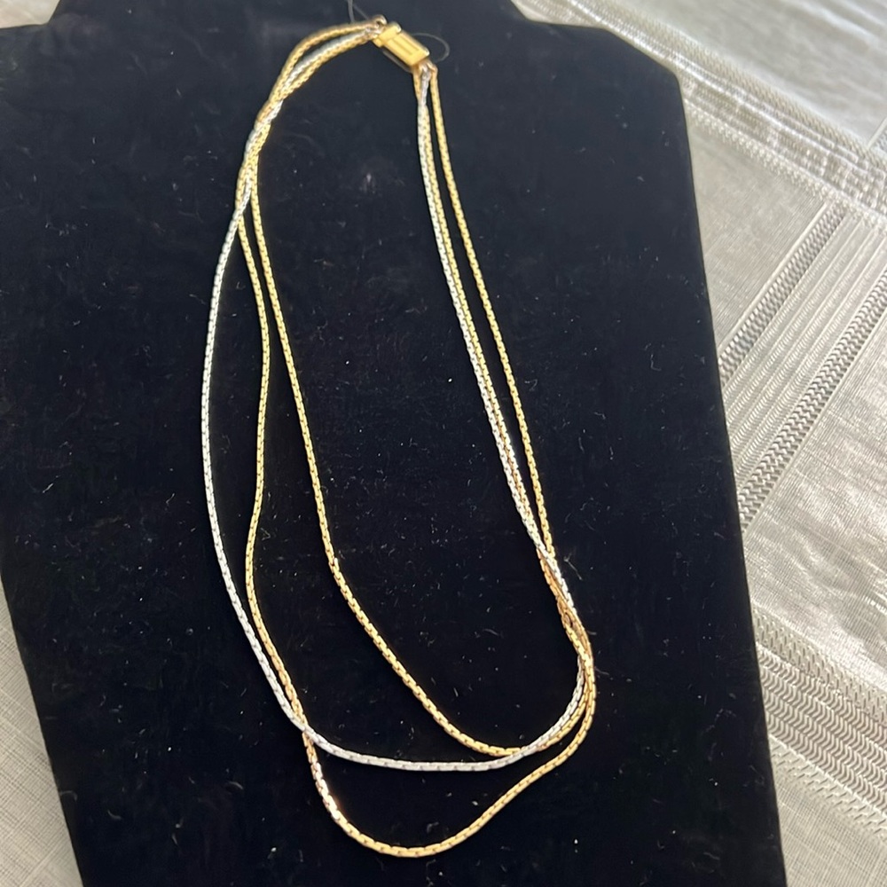 3 Strand necklace falls right below neckline. Elegant gold silver combo